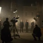 Behind the scenes of City of Shadows production, capturing a tense urban drama scene being filmed at night.