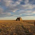 Location Scouting: Realism in 'Dust Bowl Dreams' Desolate Dust Bowl landscape with vintage farmhouse
