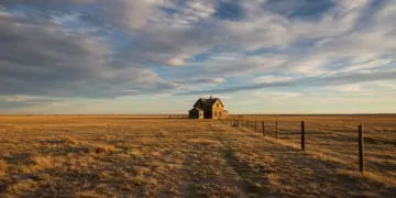 Desolate Dust Bowl landscape with vintage farmhouse