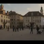 European town square used as a drama set, film crew working