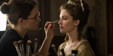 Makeup artist transforming actress for period drama scene